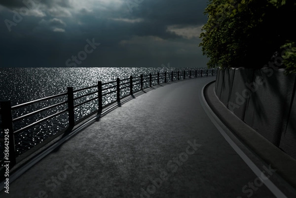 Obraz 月光がキラキラ海面に反射する夜のガードレールがある海沿いの道
