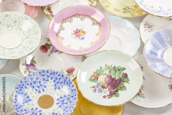 Fototapeta Beautiful vintage tea cups and saucers collection, isolated on a white background.