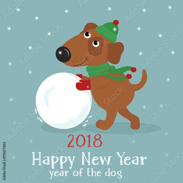 Fototapeta Christmas card with a cute cartoon dog in hat and scarf with snowball on blue background with snow. Vector illustration.