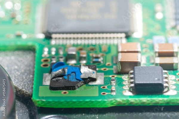 Fototapeta Closeup of electronic circuit board with processor,chip failure