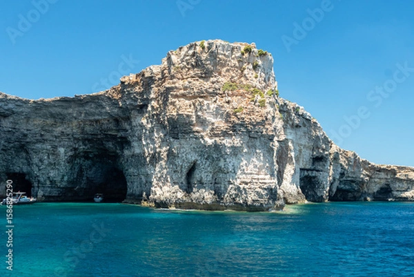 Fototapeta The stunning rocky coast of Comino, with its crystal-clear sea and astonishing colors. Malta