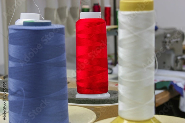 Fototapeta Colorful reels of threads. Shallow depth of field.
