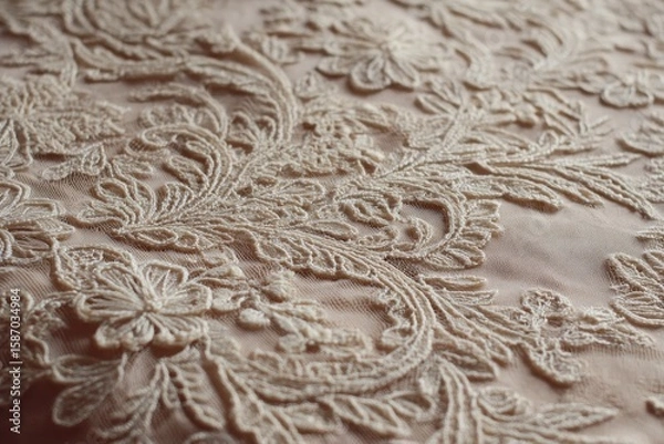 Fototapeta Intricate Lace Fabric with Floral Design on Soft Pink Background