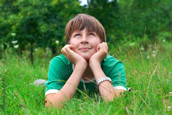 Obraz boy relaxing on grass