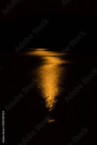 Obraz Shimmering orange glow of a moonrise on Mountainview Lake.