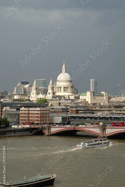 Fototapeta St Paul's Cathedral, London, UK with Blackfriars Bridge and the River Thames in the foreground.
