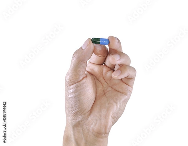 Fototapeta A human hand squeezing a dropper filled with medicine, isolated on a clean background.