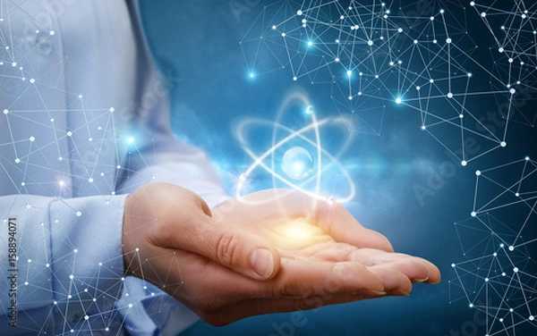 Obraz Cząsteczka atomu w kobiecych rękach.