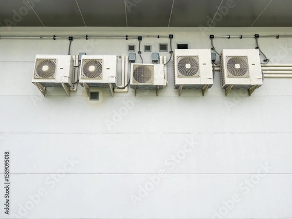 Fototapeta Air Conditioner Compressors Behind Train Power Control Building.