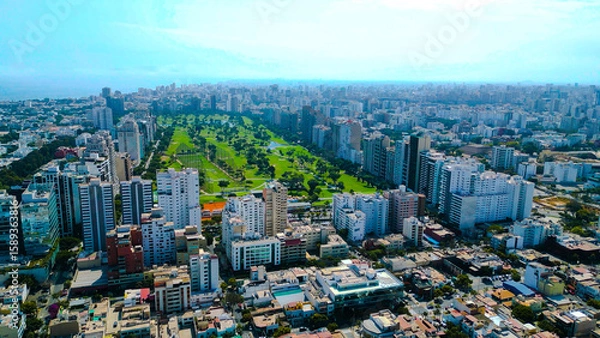 Fototapeta Aereal view of San Isidro district with a clear view of the golf club and luxury buildings.