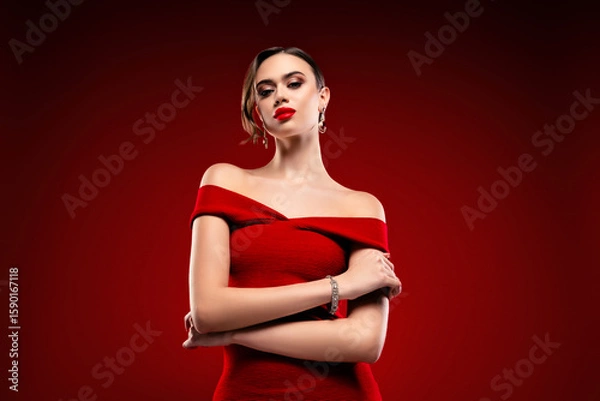 Obraz Glamorous woman in red off-shoulder dress posing confidently in a chic studio with luxurious and glamorous aesthetics