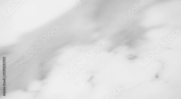 Fototapeta Abstract close-up of white marble stone surface with subtle gray veining, creating a soft, textured background.