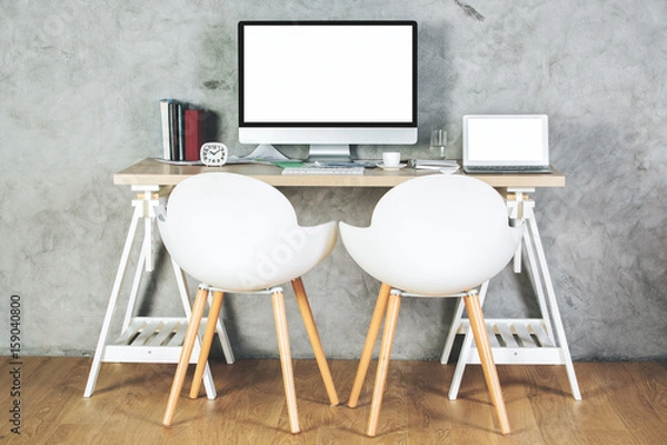 Fototapeta Contemporary office with empty pc and laptop