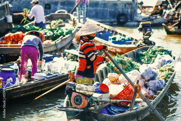 Obraz Unidentified people on floating market in Mekong river delta. Cai Rang and Cai Be markets are very popular among the local citizens and tourists.