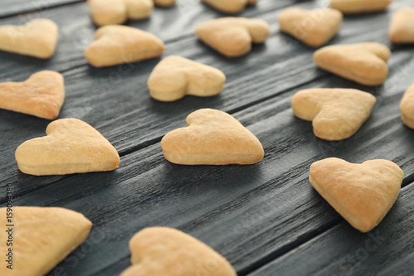 Fototapeta Heart shaped butter cookies on wooden background