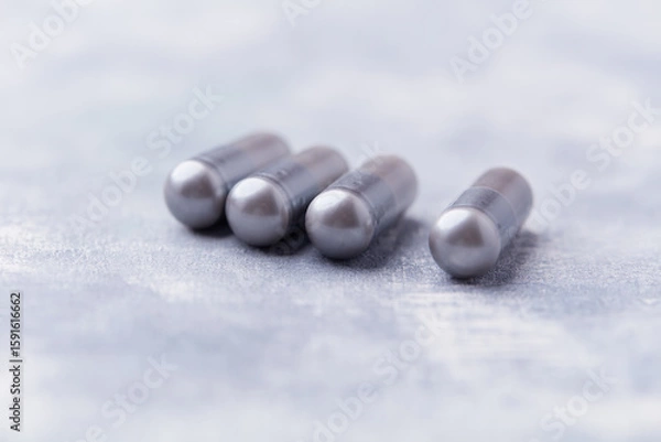 Fototapeta BCAA amino acids tablets. Nutrition for bodybuilding. Fitness supplements on bright background. Soft focus. Copy space.	