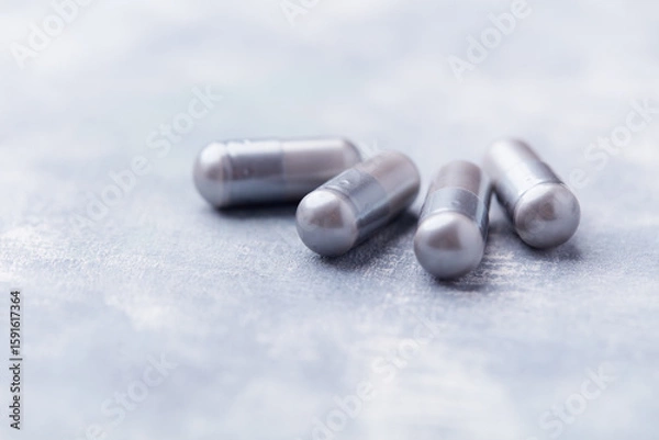Fototapeta BCAA amino acids tablets. Nutrition for bodybuilding. Fitness supplements on bright background. Soft focus. Copy space.	