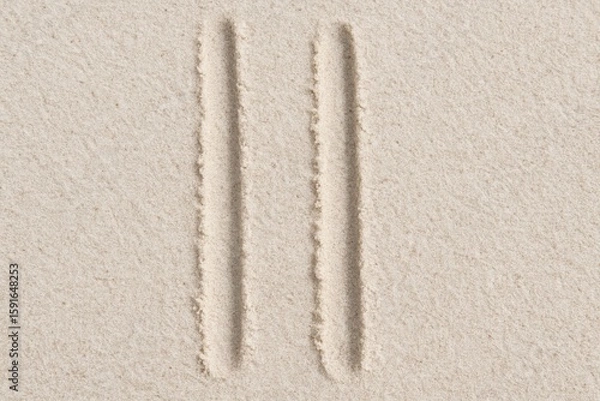 Fototapeta Minimalist sand artwork showcasing two parallel lines creating a simple, textured pattern and sandy beach background.