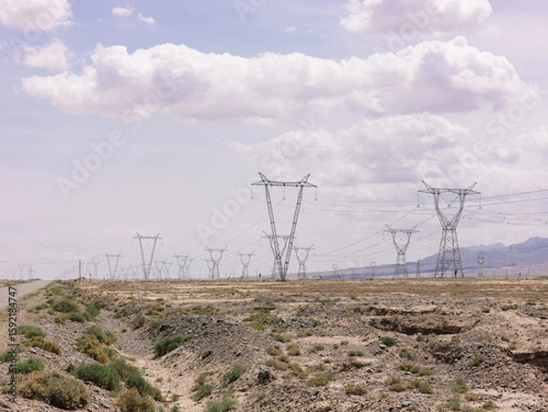 Fototapeta The high-voltage transmission tower, the power artery in the Gobi wilderness