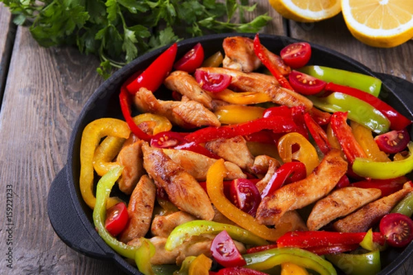 Obraz Fried chicken fillet with pepper fajitas
