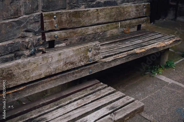 Fototapeta Rustic wooden bench for sitting in public areas.