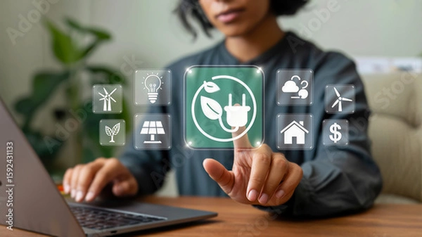 Fototapeta A person touches a glowing green icon of a power plug with a leaf, surrounded by symbols of renewable energy and environmental sustainability