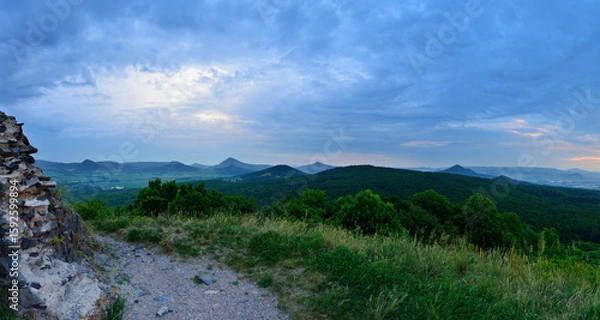 Fototapeta Rocky Summit Overlooking Czech Hills and Meadows under Soft Cloudy Sky