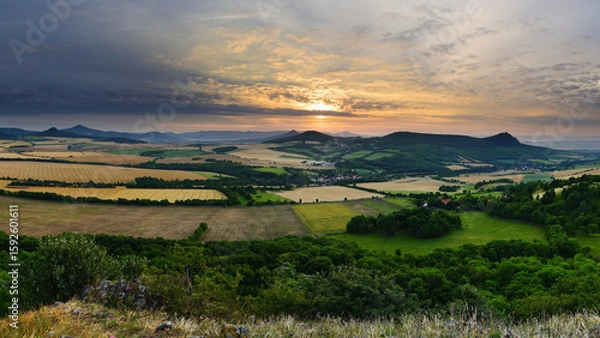 Fototapeta Rocky Summit Overlooking Czech Hills and Meadows at Gentle Sunrise with Soft Clouds
