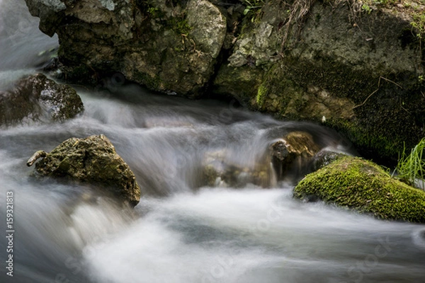 Obraz Mossy rock with the river . long exposure