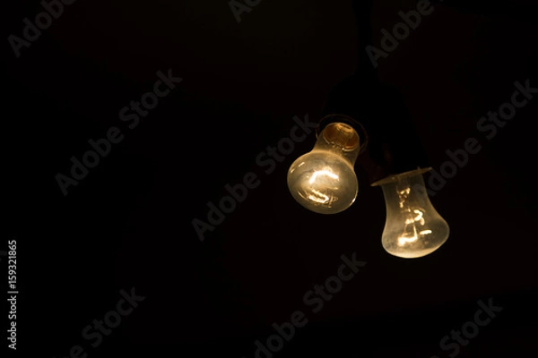 Obraz Two light bulb in the dark