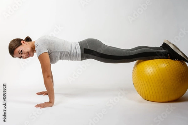Obraz Beautiful Model doing exercise on ball