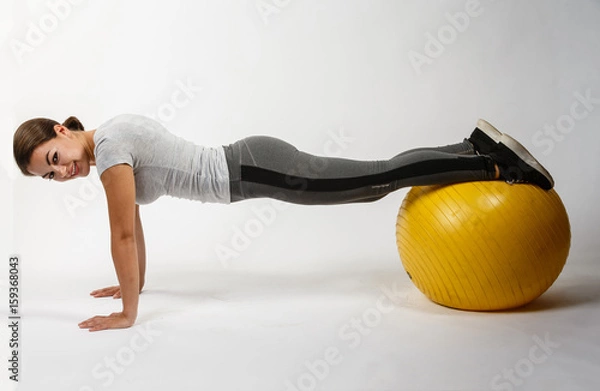 Obraz Beautiful Model doing exercise on ball
