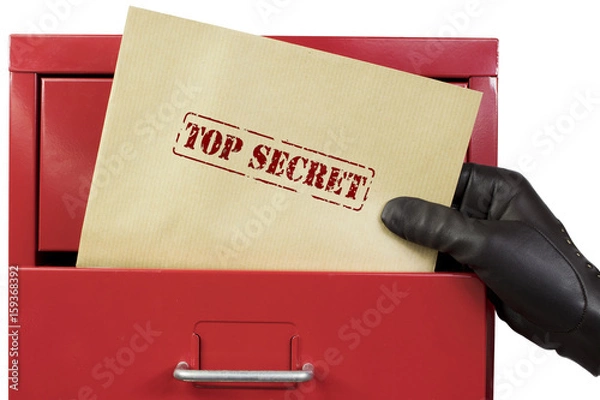Fototapeta Getting top secret documents from a red file cabinet, over a white background.