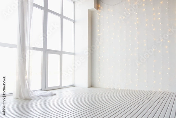 Fototapeta Bright minimalist room with large window and soft hanging string lights creating a serene atmosphere.