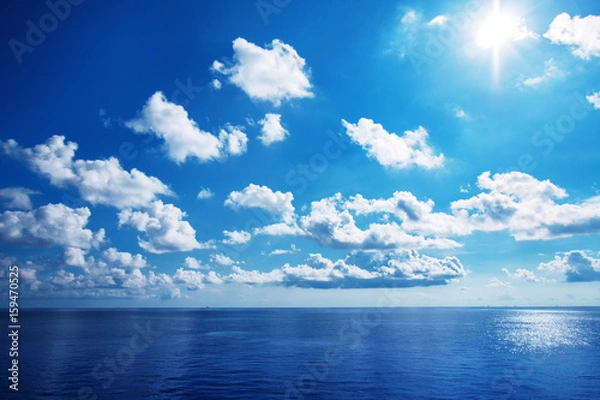Obraz White cloudy with blue sky on the sea as background