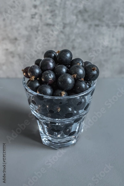 Fototapeta Fruits and berries. Blackcurrant as a source of vitamins. Immunity products. Juicy black berries. Healthy dessert. Vegetarian menu. Ingredient for a pie or cake.