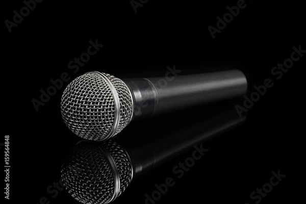 Obraz Dynamic microphone on black background