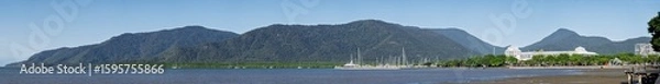 Fototapeta View from Cairns esplanade foreshore, panorama pano banner, ocean with mountains in background, Queensland, Australia