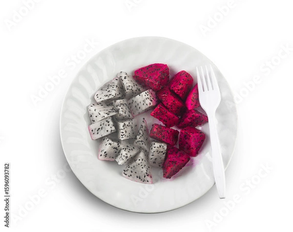 Fototapeta red and white dragonfruit slices on a white plate isolated