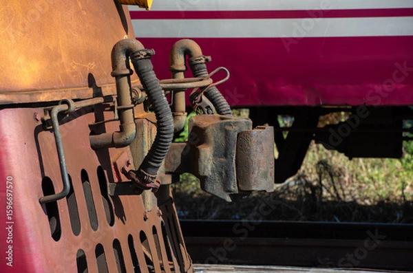 Fototapeta The mechanism of coupling of train cars close up, coupling of railway cars, wagon connection