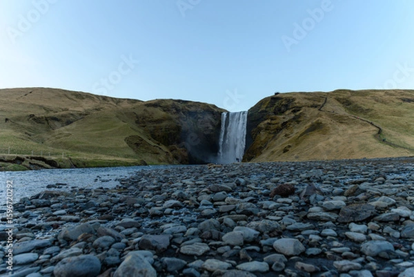 Fototapeta Famous Skogafoss waterfall in Iceland in early evening sun