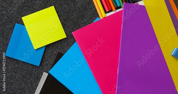 Fototapeta Colored notebook, colored pencils and other learning tools