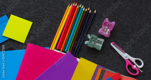Fototapeta Colored notebook, colored pencils and other learning tools