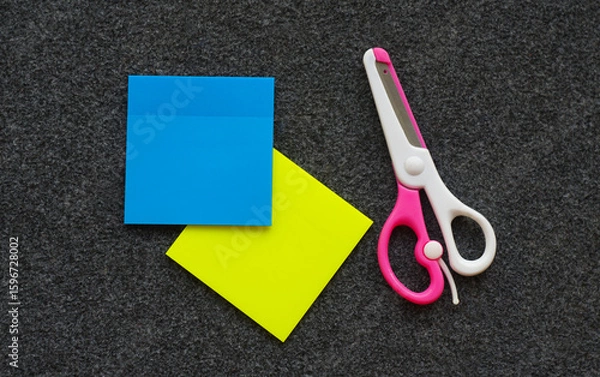 Fototapeta Colored paper and scissors on the table