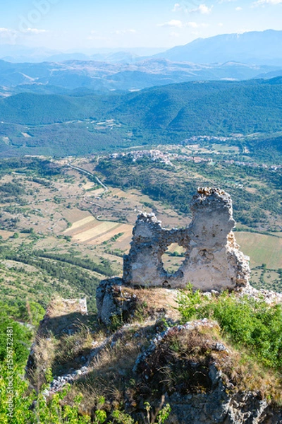 Fototapeta Italy, July 5, 2025: Ruins of Rocca Calascio Castle, an Italian tourist destination and landmark in the Gran Sasso National Park, L'Aquila, Abruzzo. Clear blue skies at sunset.
