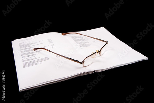 Fototapeta Glasses on a notebook