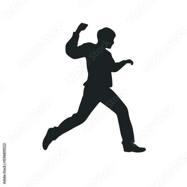 Fototapeta Silhouette in Motion: A dynamic silhouette of a man in mid-stride, embodying action and determination, is captured in a stark, yet compelling, monochrome composition.