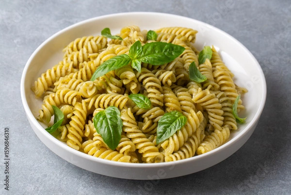 Fototapeta Fusilli pasta, spiral or spirali pasta with Basil Sauce or Pesto sauce