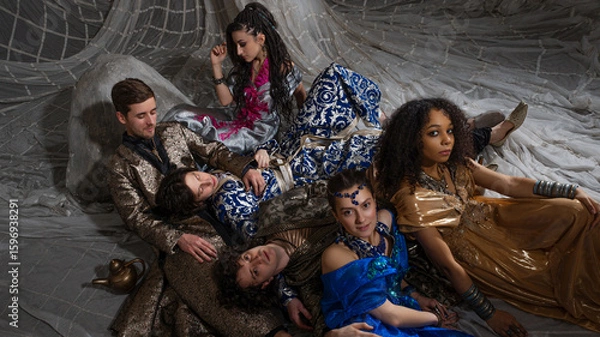 Fototapeta Middle Eastern fairytale group shot, models in luxurious Arabic attire against exotic backdrop