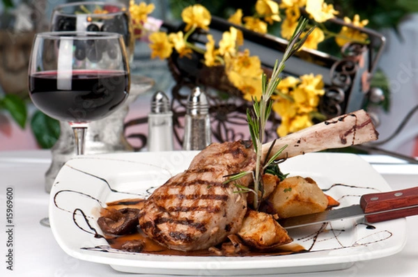 Fototapeta Veal Chop dinner and wine